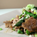 plate of sliced beef and asparagus