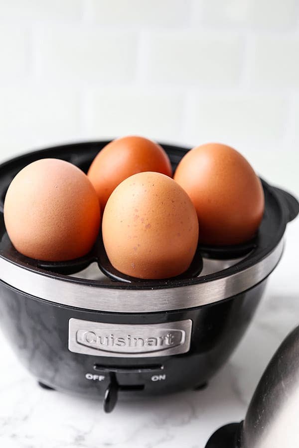 Eggs in the tray of an egg cooker.