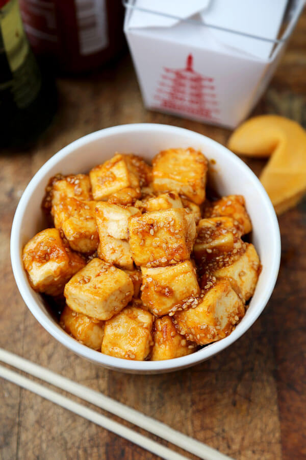 Honey Sriracha Tofu - Spicy and sweet, crispy on the outside and silky on the inside. Tofu has never tasted so good! Healthy tofu recipes, vegetarian recipes, main, Asian, spicy fried tofu recipes, healthy vegetarian dinner recipe | pickledplum.com