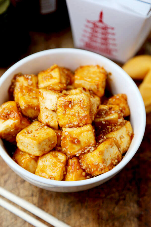 bowl of crispy tofu with honey sriracha sauce