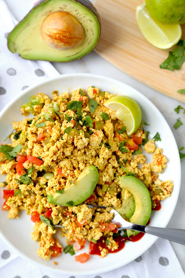Mexican Style Tofu Scramble - An easy and delicious vegan breakfast recipe you can serve for dinner too! This Mexican Style Tofu Scramble Recipe could easily pass for a hearty plate of Huevos Rancheros! No turmeric used, we are going for Tex Mex flavors! #tofurecipes #tofuscramble #veganrecipes #veganbreakfast #meatlessmonday | pickledplum.com