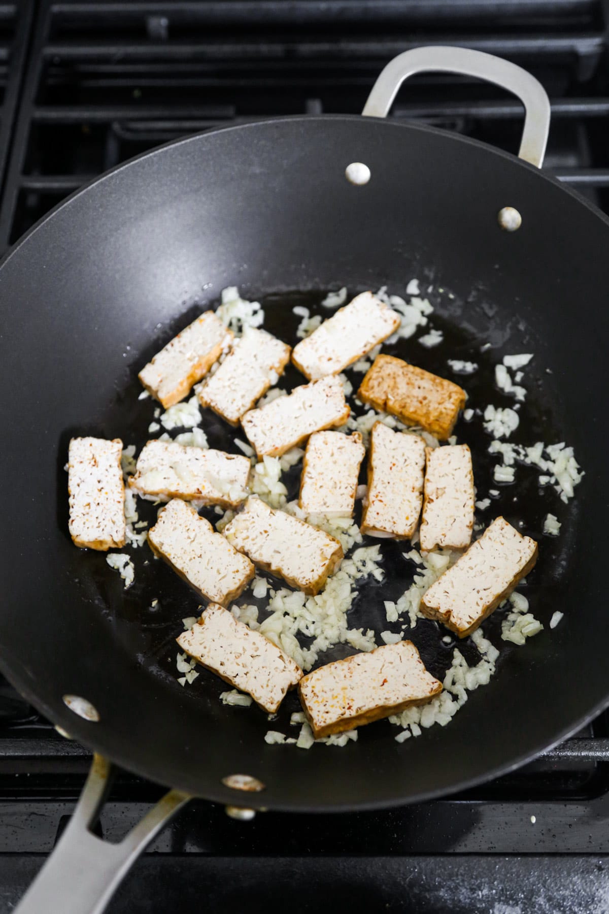 Smoked tofu and garlic in skillet