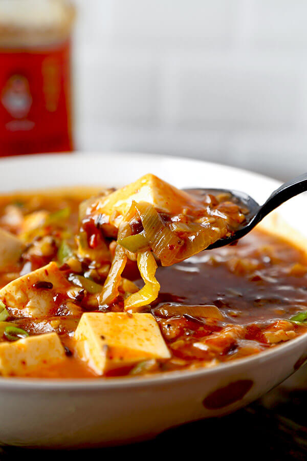 Vegan Mapo Tofu Recipe - Make this mapo tofu at home and never order it again! Mushrooms make this vegan mapo tofu recipe tastier and healthier than the ground meat version. Plus, they crank the level of umami up to 11! tofu recipe| Chinese food recipe | Szechuan Food | spicy tofu recipe | Asian Food Recipes | pickledplum.com