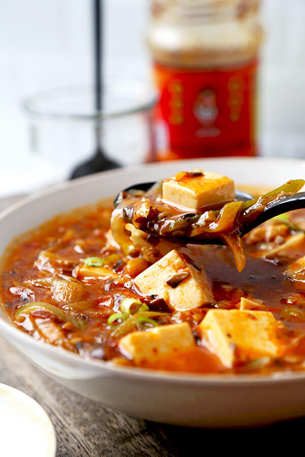 Vegan Mapo Tofu Recipe - Make this mapo tofu at home and never order it again! Mushrooms make this vegan mapo tofu recipe tastier and healthier than the ground meat version. Plus, they crank the level of umami up to 11! tofu recipe| Chinese food recipe | Szechuan Food | spicy tofu recipe | Asian Food Recipes | pickledplum.com